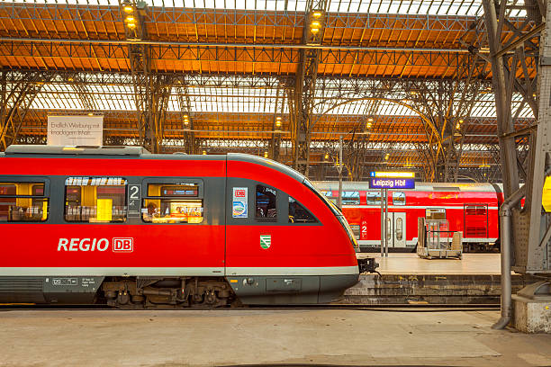 Regio train at Leipzig main station "Leipzig, Germany - August 26, 2011: Deutsche Bahn Regio train stopped at the Leipzig main train station in the early evening. Other trains can be seen in the background, and passengers are visible onboard." deutsche bahn stock pictures, royalty-free photos & images