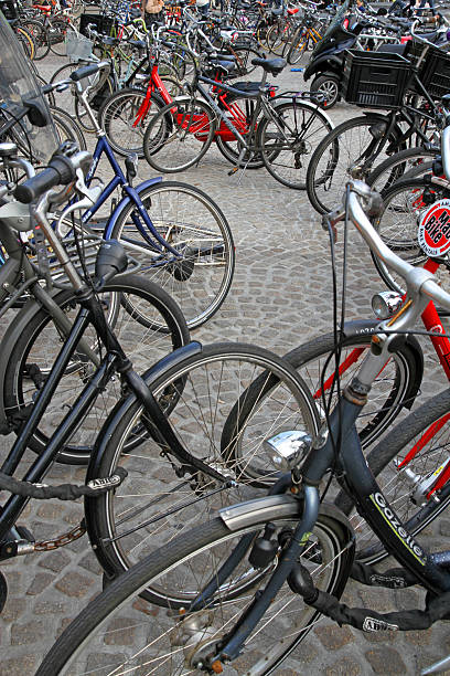 criss-räder - bicycle bicycle rack orange amsterdam stock-fotos und bilder