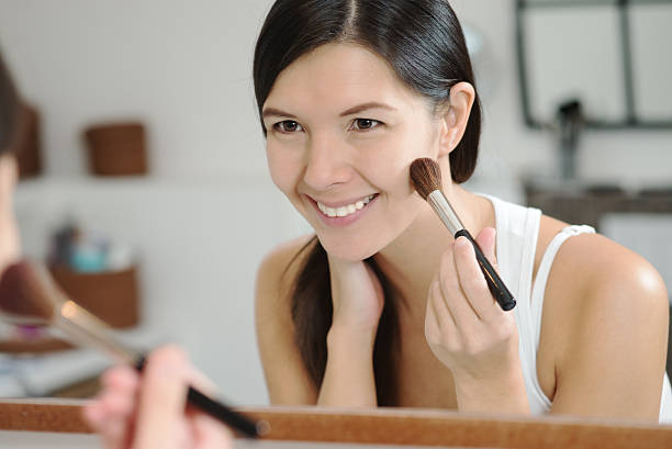 istock Attractive happy woman applying makeup 459020679