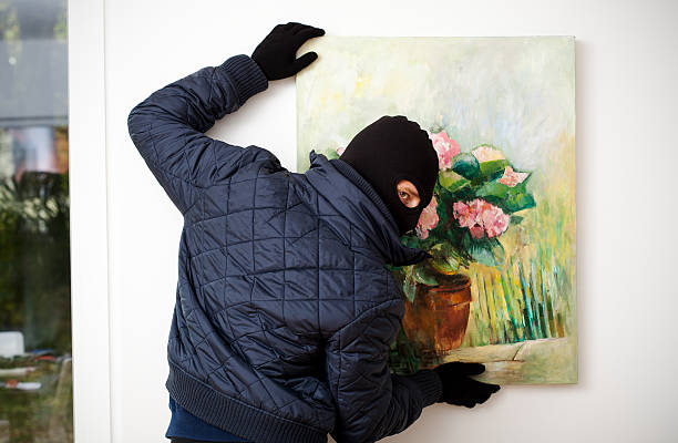 Stealing the work of art. Thief stealing the piece of art from gallery of art. burglary photos stock pictures, royalty-free photos & images