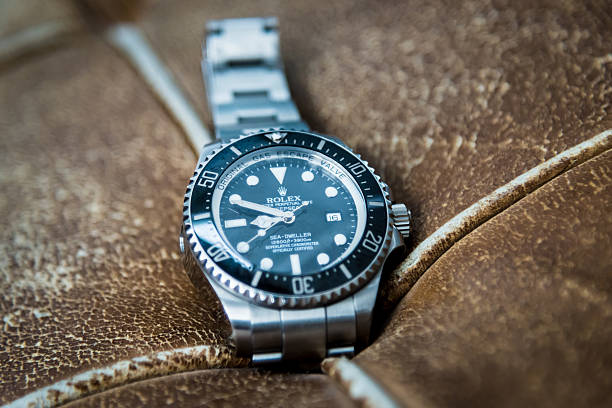 Rolex Seadweller Deepsea Wristwatch "Stuttgart, Germany - January 27, 2013: Rolex Oyster Perpetual DEEPSEA Seadweller Watch Reference 116660 Collectors Luxury Watch on old vintage leather." swiss watches stock pictures, royalty-free photos & images