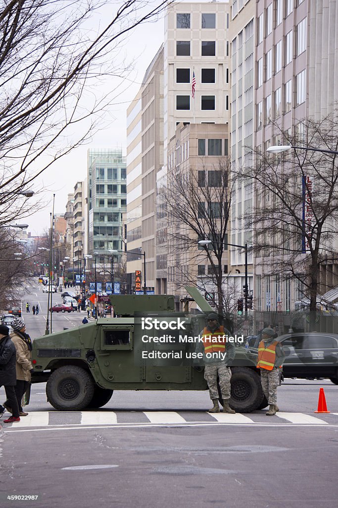 Military Vehicle and Soldiers In DC "Washington DC, USA - January 21, 2013: Military Vehicle and Soldiers In DC.  Soldiers and their Humvee blocked 18th street in Washington DC on January 21st which was Inauguration Day." Activity Stock Photo