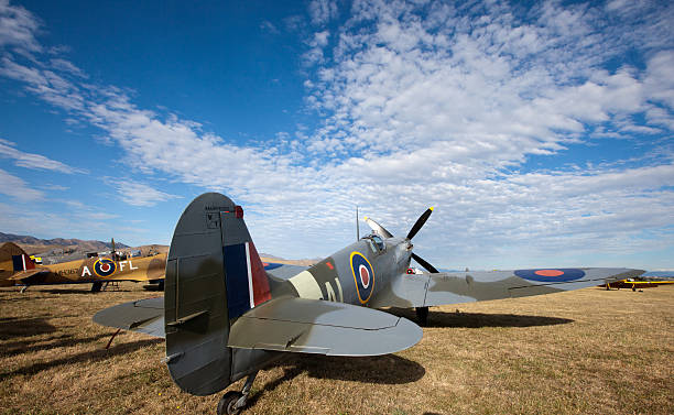 Omaka Air Show, Blenheim, New Zealand "Blenheim, New Zealand - March 30th, 2013: Photo of Two Spitfire planes on the ground at the Omaka Air Show in Blenheim, New Zealand. The Spitfire in the foreground is a IX and one in desert colors is a TR9. Both served in the second World War." spitfire stock pictures, royalty-free photos & images