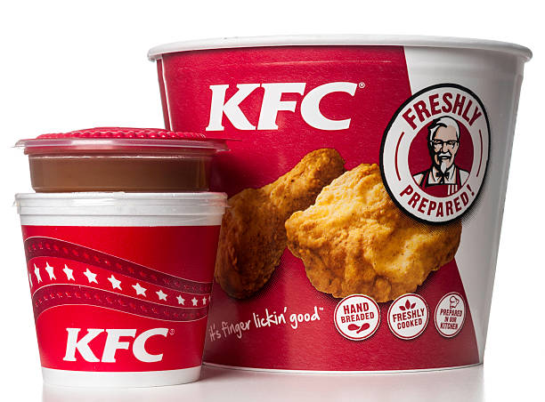 KFC bucket with mashed potatoes and signature gravy "Miami, USA - February 28, 2012: KFC bucket with mashed potatoes and signature gravy. KFC brand is owned by KFC Corporation and a subsidiary of Yum! Brands, Inc." KFC Chicken stock pictures, royalty-free photos & images