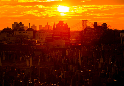 New York City, USA - January 6, 2013: View of Manhattan from Brooklin, from BQE across the Calvary Cemetery, at sunset