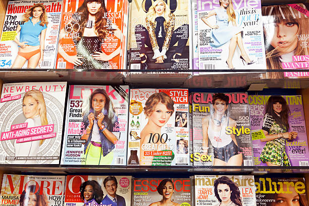 Stack of magazines # 7 XXL "New York City, USA - December 17, 2012: Stack of popular magazines for women on the outside of the street side newsstand on Broadway Upper West. The Oprah Magazine, Vogue, Elle, Bazaar, Marie Claire, Allure, Allure, Cosmopolitan and More can be seen." newspaper titles stock pictures, royalty-free photos & images