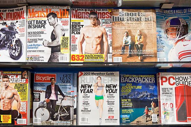 Stack of magazines # 8 # L "New York City, USA - December 17, 2012: Stack of popular magazines for men on the outside of the street side newsstand on Broadway Upper West. Men's Health, Men's Fitness, Bicycle, Marathon Guide and Backpacker can be seen." newspaper titles stock pictures, royalty-free photos & images