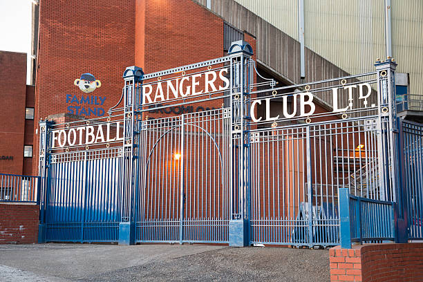 Ibrox Stadium, Glasgow "Glasgow, UK - March 28, 2013: The Rangers Football Club Ltd. sign over the gates between the Main Stand and the Broomloan Road Family Stand at Ibrox Stadium, Glasgow, the home ground of Rangers Football Club." ibrox stock pictures, royalty-free photos & images