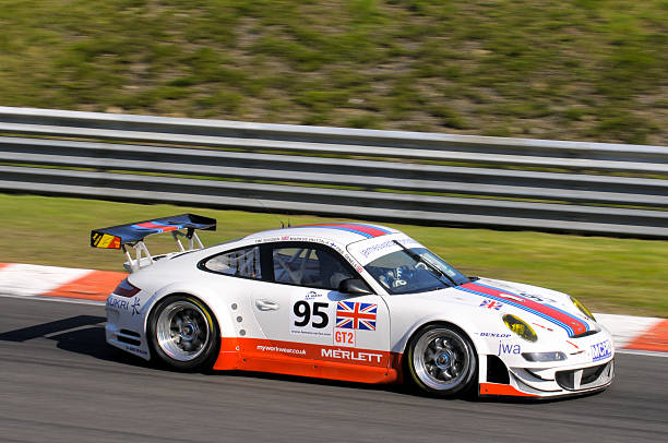 Spa, Belgium - May 09, 2008: James Watt Automotive Porsche 911 driving on the straight during the 1000km of Spa. The cars are participating in the 2008 European Le Mans Series.