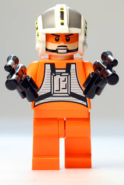 Lego Pilot "Vancouver, Canada - December 18, 2012: A Lego Pilot from the Star Wars film franchise, posed against a White background." ambidextrous stock pictures, royalty-free photos & images