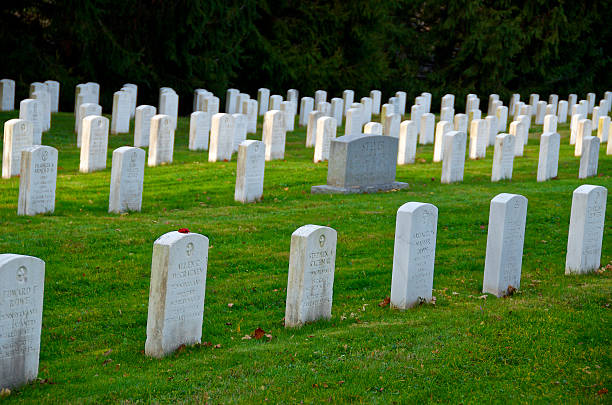 Gettysburg National Cemetery Headstones, Pennsylvania USA "Gettysburg Pennsylvania, USA - November 15, 2012: Rows of WWII era soldier's headstones seen at Gettysburg National Cemetery, Pennsylvania." gettysburg national cemetery stock pictures, royalty-free photos & images
