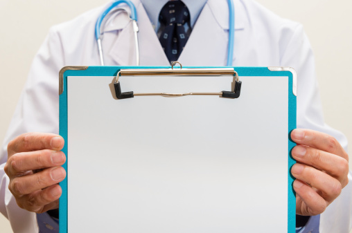 A doctor holding a clipboard. (XXXLarge)