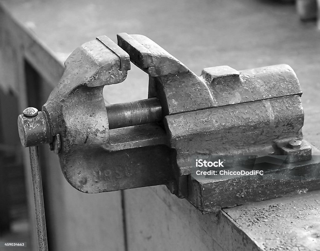 work in a vise Workbench strong work in a vise Workbench of a blacksmith in a mechanical workshop Checkout Stock Photo