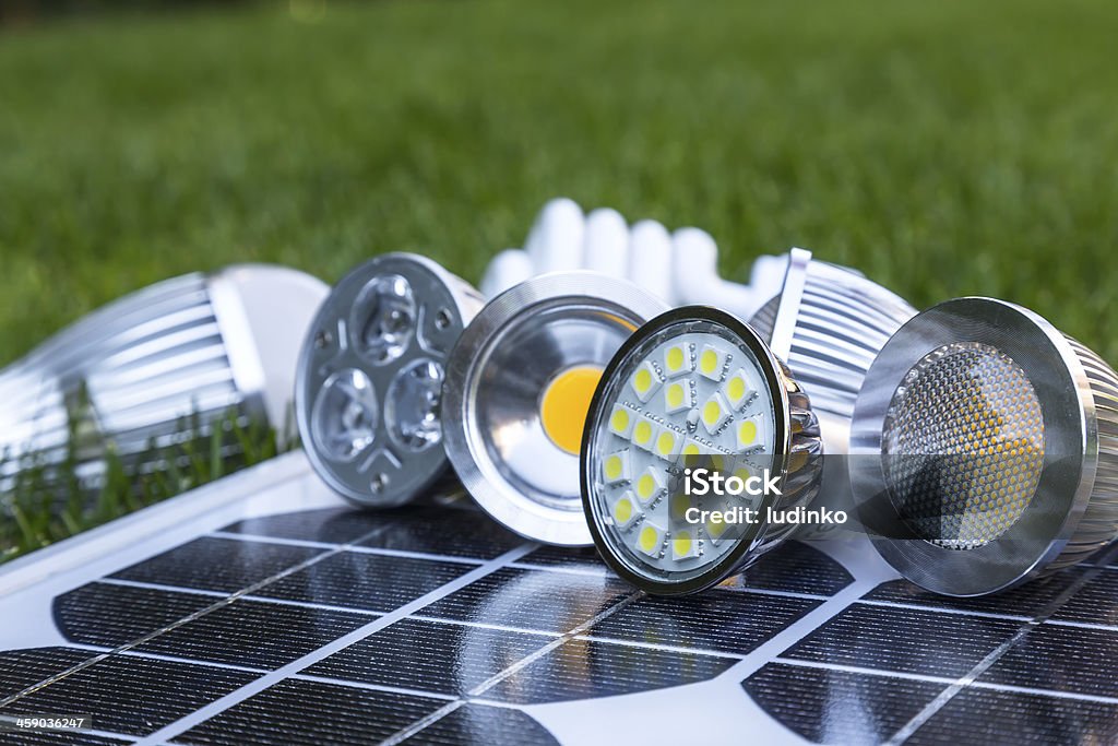 GU10 LED bulbs on Photovoltaics in the grass GU10 LED bulbs on photovoltaics, in the grass E27 LED and CFL Bright Stock Photo