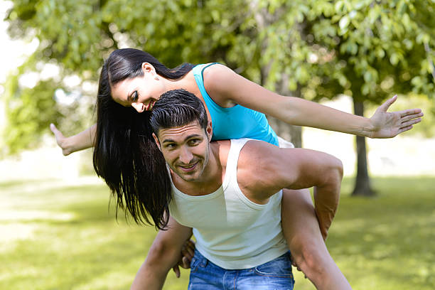 istock Happy smiling couple in urban park 459039367