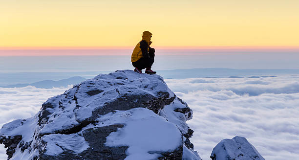 istock hiker at sunrise on the mountain top 459042247