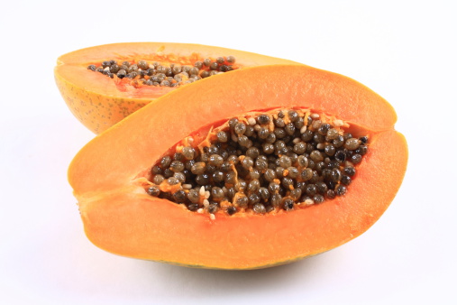 Fresh and tasty papaya on black background.