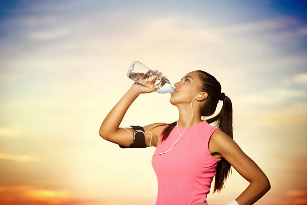 istock sporty girl  drinking water 459058917