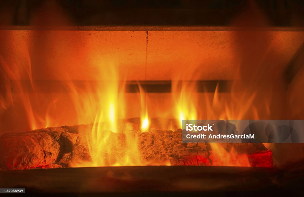 Fireplace flames in winter Log fire in a fireplace. Ash Stock Photo