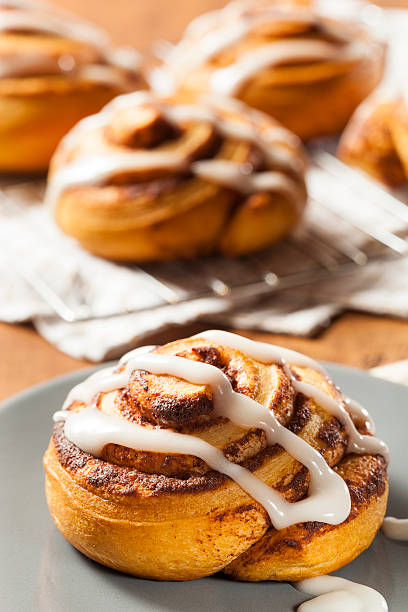 istock Homemade cinnamon buns with icing drizzled on top 459058961