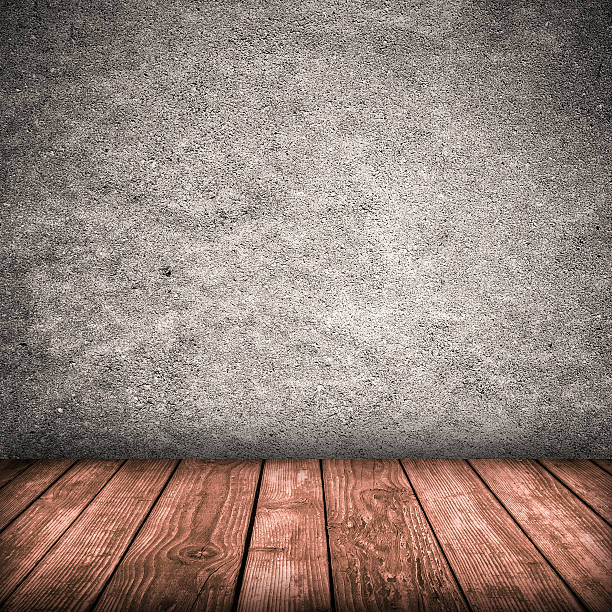 Gray wall and wooden floor stock photo