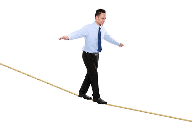istock business man on rope  balancing 459059673