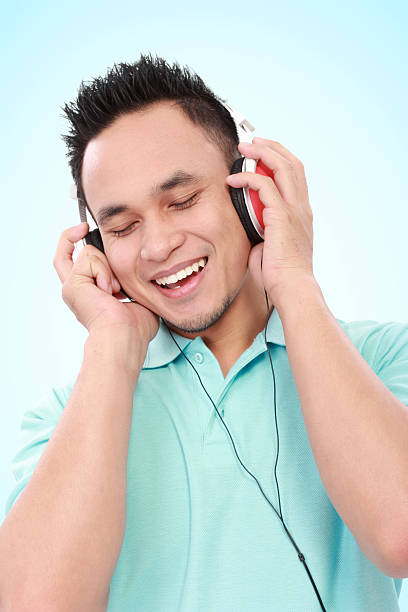 istock young man listening to music 459060399