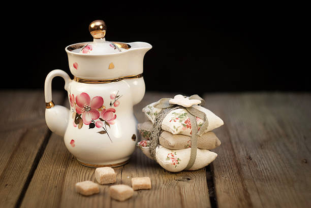 istock Portselana tea pot with sugar cubes and handmade pillows 459062469