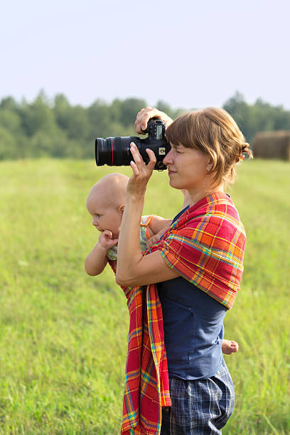 istock Mother with the kid on hands photographs 459065619
