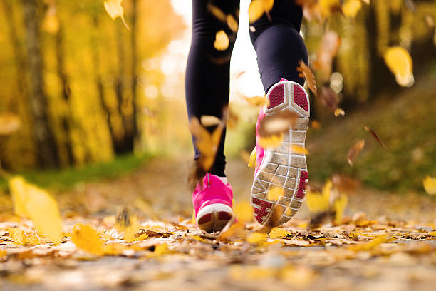 runner - autumn jogging outdoors running стоковые фото и изображения