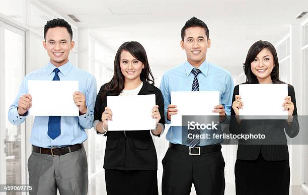 Business Team Holding Blank Paper Stock Photo - Download Image Now - Adult, Adults Only, Advertisement