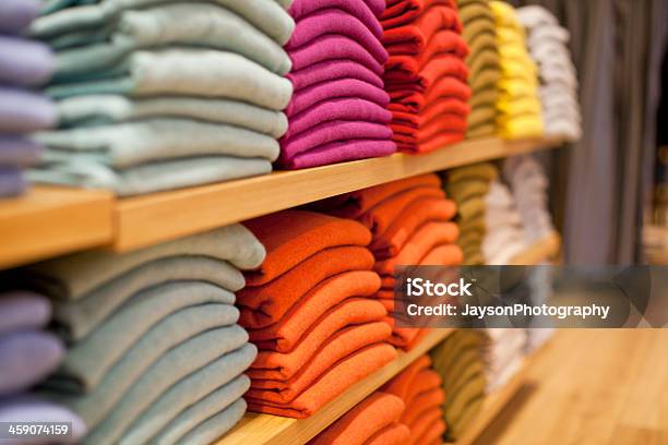 Colorful Display Of Sweaters On Shelf In Store Stock Photo - Download Image Now - Clothing, Clothing Store, Retail