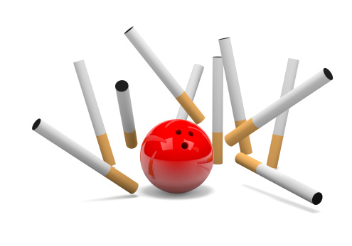 Strike of Cigarette with Red Bowling Skittle Ball on White Background 3D Illustration