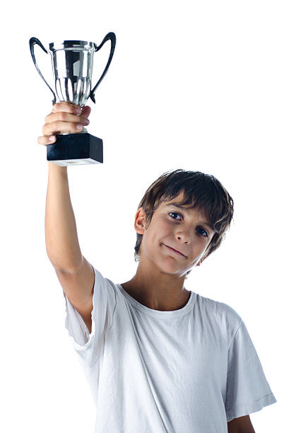 istock champion child holding winner cup 459081719