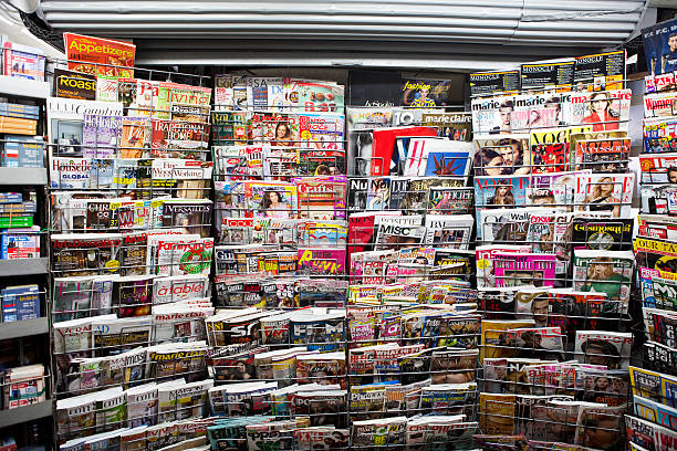 Magazines Athens, Greece - December 15, 2013 Stack of magazines for women on a newsstand at Athens Omonoia Square, Numero L'oficiell Marie claire Vogue Elle newspaper titles stock pictures, royalty-free photos & images