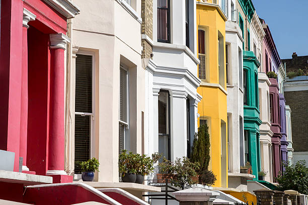 istock Different colored painted houses in a street 459086285