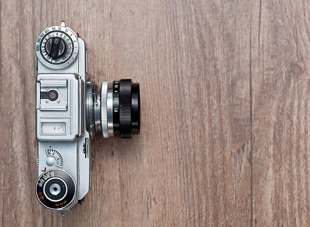 istock Vintage photo camera on a wooden background 459088153