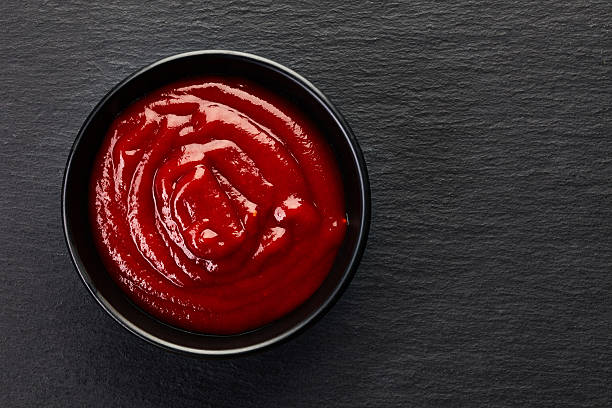 bowl of tomato sauce bowl of tomato sauce ketchup barbeque sauce photos stock pictures, royalty-free photos & images