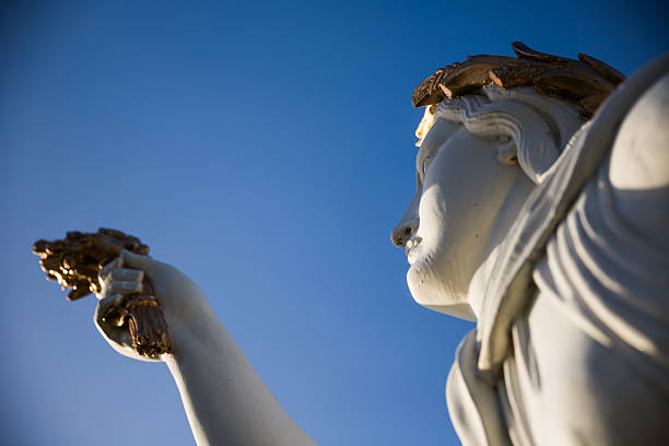 istock White and golden figurehead against deep blue sky 459089957