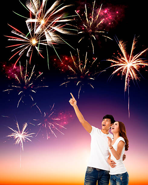 istock happy young couple watching  fireworks in the sky 459093387