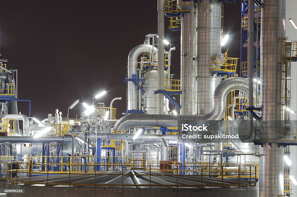 Chemical industrial plant in night time Night scene of Lighting reflection in Chemical industrial plant Petrochemical Plant Stock Photo