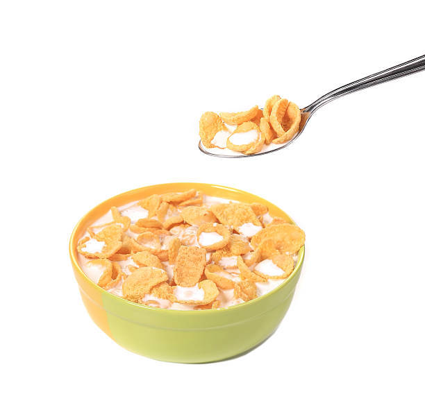 istock Bowl of sugar-coated corn flakes and spoon. 459098371