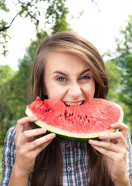 istock woman and watermelon 459118781