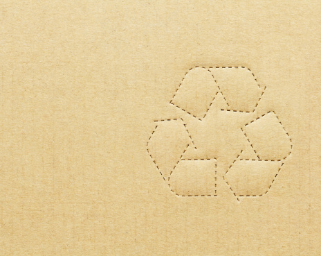 Cardboard box background with recycle symbol