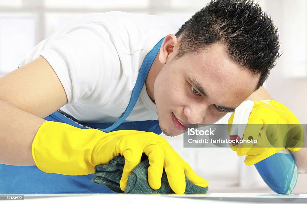 male doing cleaning portrait of man doing some cleaning work in the house Adult Stock Photo