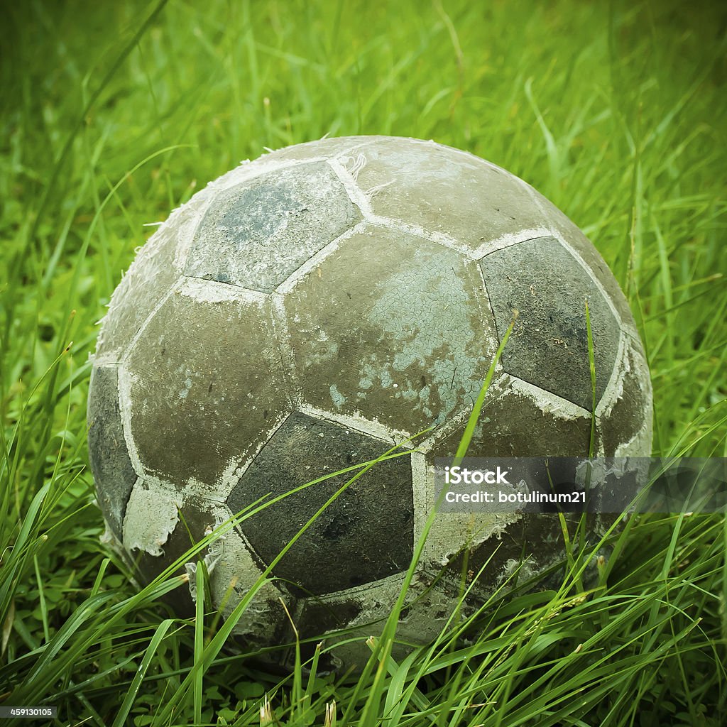 old ball put on green grass old ball put on grass process vintage style Antique Stock Photo