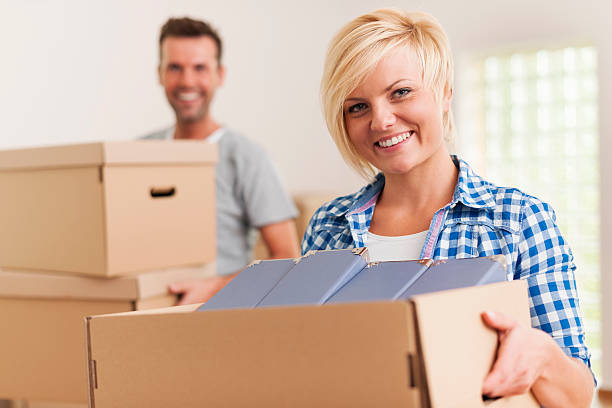 istock Smiling woman during the moving house 459130519