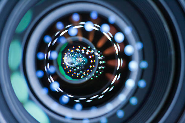 istock Blue, white, and green Light reflection in lenses of a lens 459132113