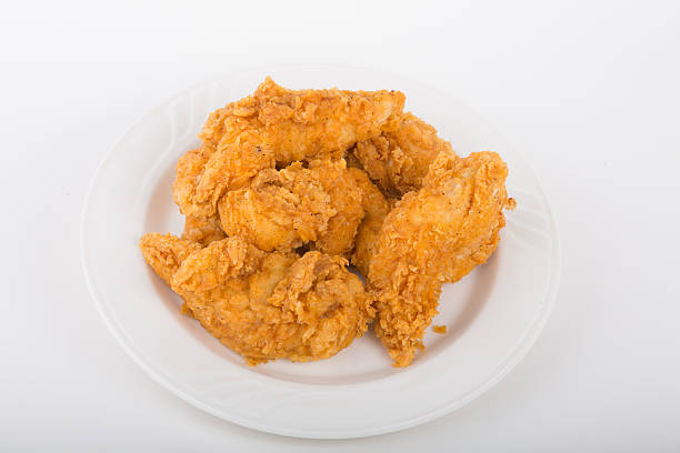 istock A small plate of fried chicken strips on a white background 459135703
