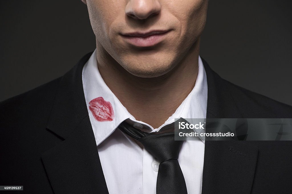 Lipstick on your collar. Man with lipstick on his collar Infidelity Stock Photo